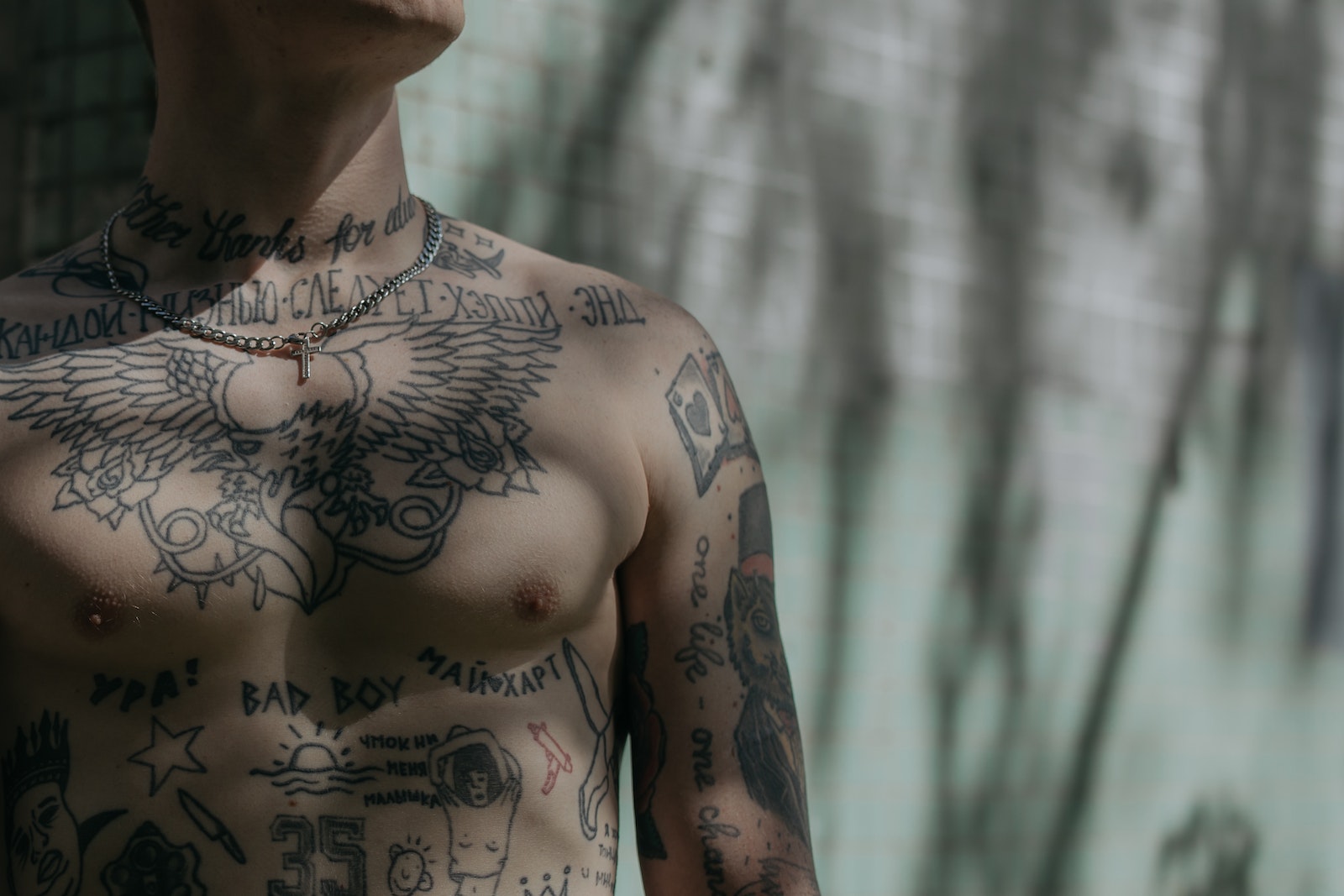 Close-up Shot of a Man's Chest with Tattoo